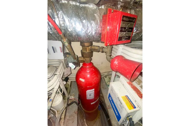 Sunset Grille Yacht Photos Pics Engine room of 1990 Hatteras 62 Cockpit Motor Yacht with fire suppression system.