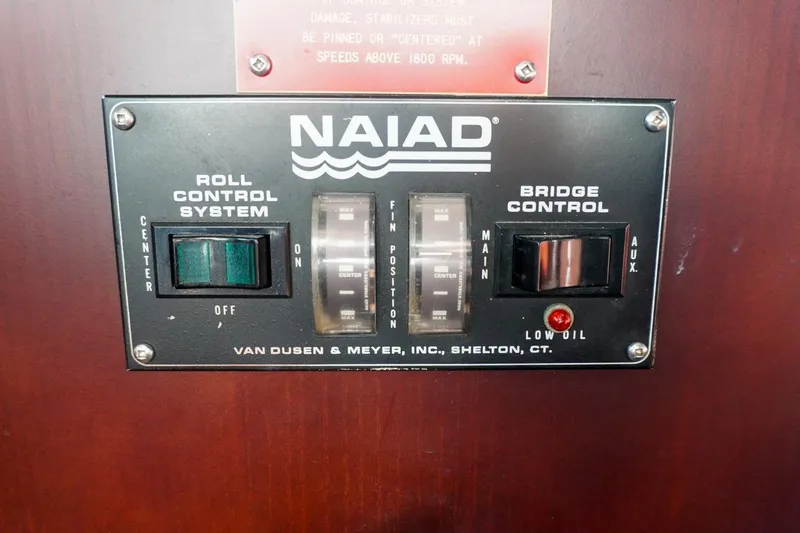 Sunset Grille Yacht Photos Pics Control panel of a 1990 Hatteras 62 Cockpit Motor Yacht, featuring Naiad roll control system.
