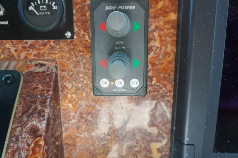 Sunset Grille Yacht Photos Pics Control panel of a 1990 Hatteras 62 Cockpit Motor Yacht with bow and stern thrusters.