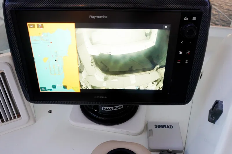 Sunset Grille Yacht Photos Pics Raymarine navigation display on 1990 Hatteras 62 Cockpit Motor Yacht dashboard.