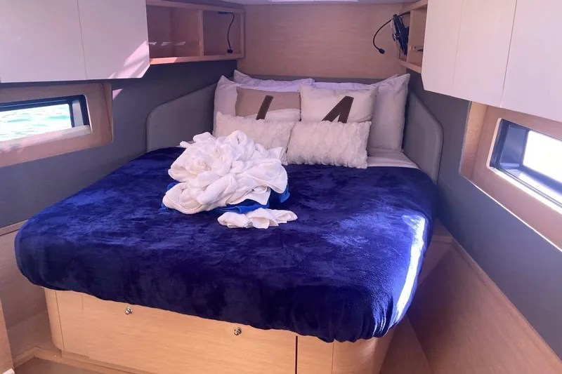 Seabreeze Smile Yacht Photos Pics Luxurious cabin interior of 2023 Dufour 41 yacht with plush bedding and modern design.