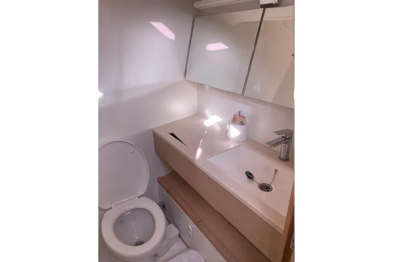 Seabreeze Smile Yacht Photos Pics Modern bathroom in 2023 Dufour 41 yacht with sleek sink and toilet.