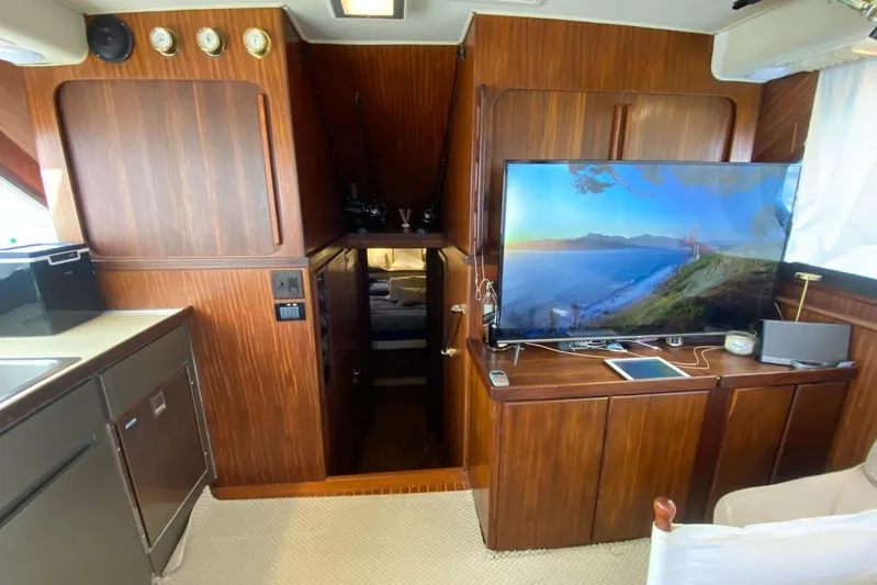  Yacht Photos Pics Interior of 1990 Hatteras 41 Convertible yacht with wood paneling and modern amenities.