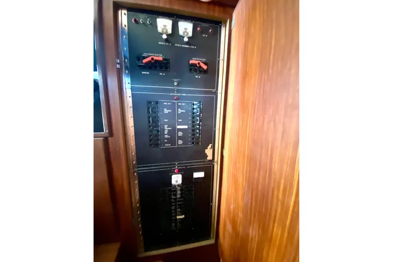  Yacht Photos Pics Electrical panel inside 1990 Hatteras 41 Convertible yacht, featuring circuit breakers and switches.