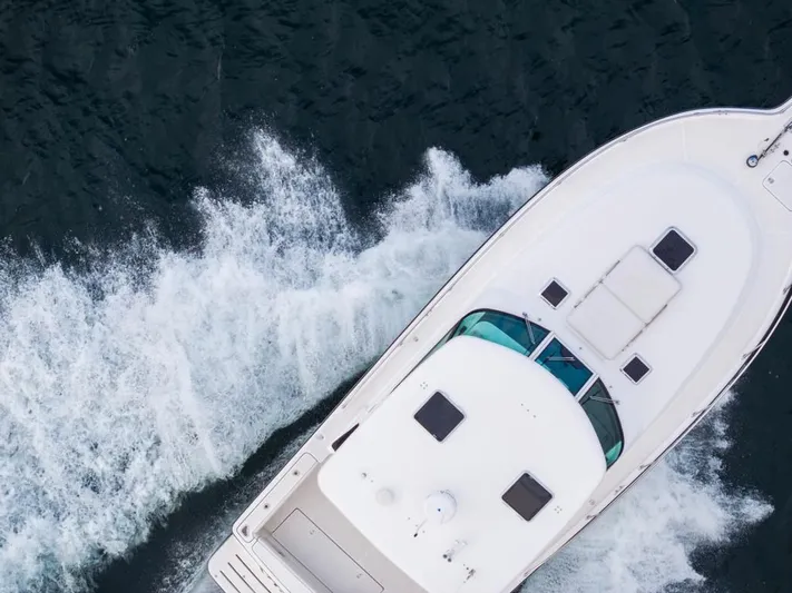  Yacht Photos Pics Aerial view of 2004 Tiara Yachts 3800 Open cruising on water.