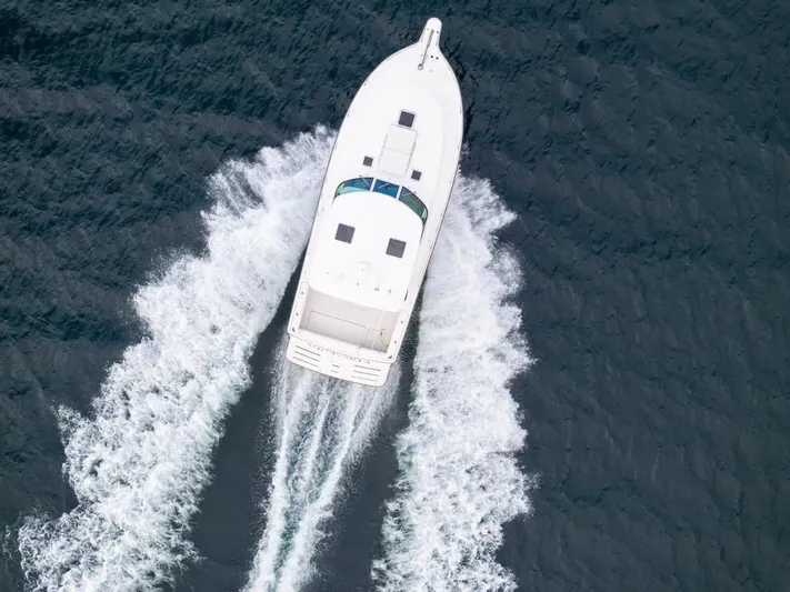 Yacht Photos Pics Aerial view of 2004 Tiara Yachts 3800 Open cruising on the ocean.
