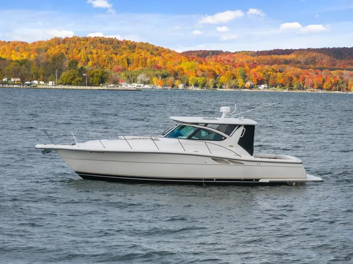  Yacht Photos Pics 2004 Tiara Yachts 3800 Open on a lake with autumn foliage background.