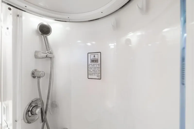  Yacht Photos Pics Shower area in 2004 Tiara Yachts 3800 Open, featuring chrome fixtures and white interior.