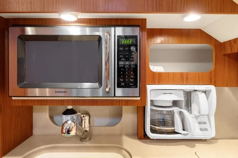  Yacht Photos Pics 2004 Tiara Yachts 3800 Open galley with microwave, coffee maker, and sink.