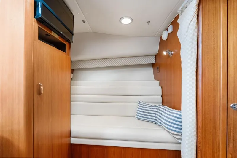  Yacht Photos Pics 2004 Tiara Yachts 3800 Open cabin interior with wood paneling and cozy seating.