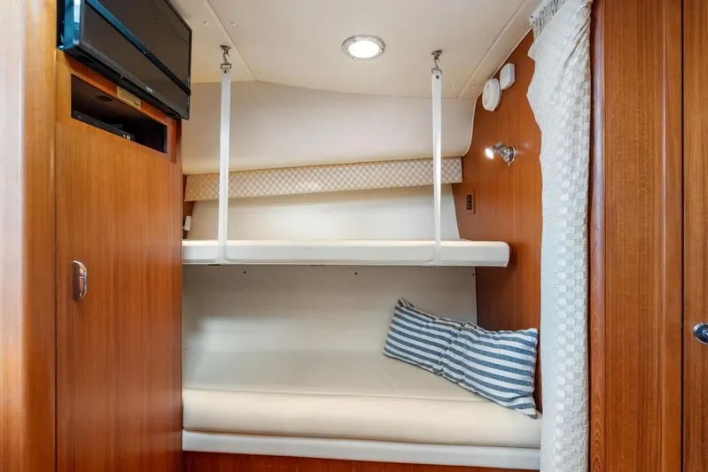  Yacht Photos Pics 2004 Tiara Yachts 3800 Open cabin interior with bunk beds and wooden finish.