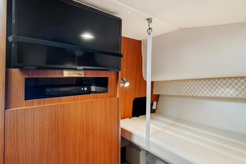  Yacht Photos Pics 2004 Tiara Yachts 3800 Open interior with TV and cozy seating area.