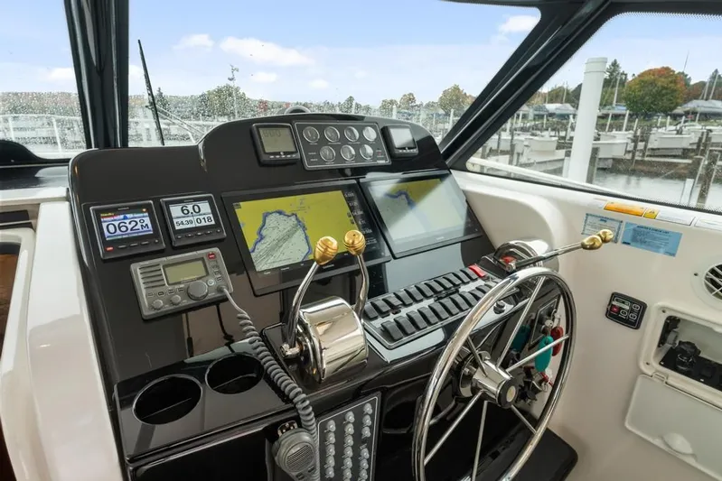  Yacht Photos Pics Control panel of a 2004 Tiara Yachts 3800 Open, featuring navigation and communication equipment.