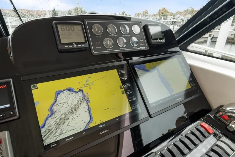  Yacht Photos Pics Dashboard of 2004 Tiara Yachts 3800 Open with navigation screens and controls.