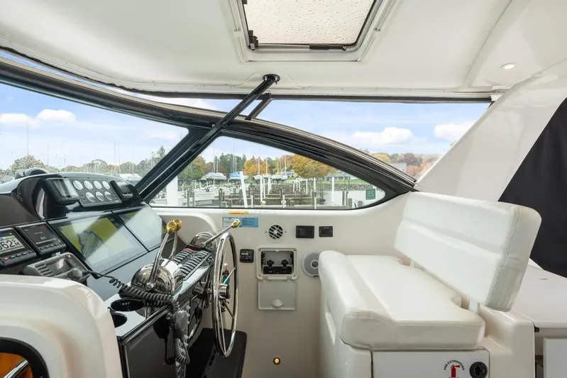  Yacht Photos Pics Interior view of 2004 Tiara Yachts 3800 Open helm with modern controls and seating.
