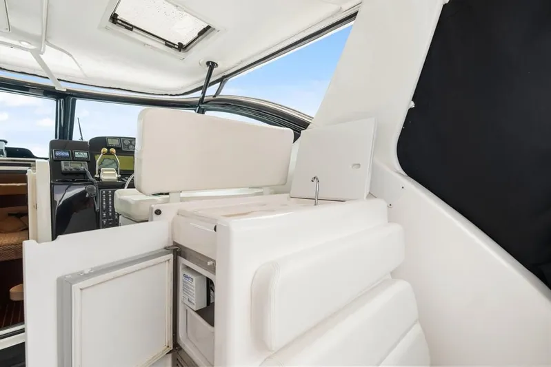  Yacht Photos Pics 2004 Tiara Yachts 3800 Open interior with helm, seating, and storage compartments.