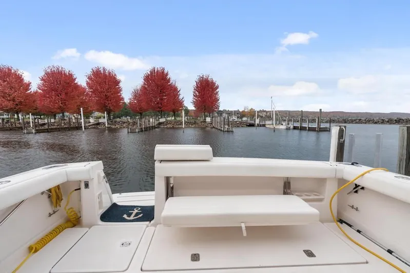  Yacht Photos Pics 2004 Tiara Yachts 3800 Open at dock, autumn trees in background, calm water.