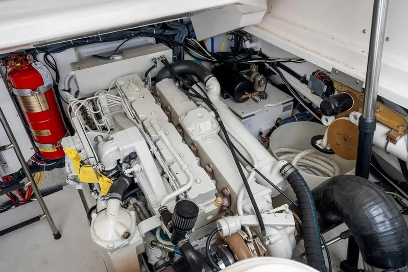  Yacht Photos Pics Engine room of a 2004 Tiara Yachts 3800 Open, featuring a well-maintained engine.