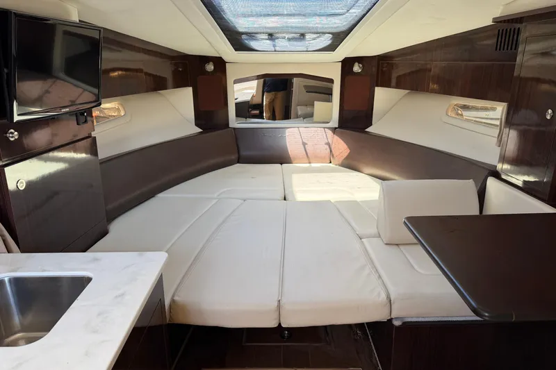  Yacht Photos Pics Luxurious interior of 2017 Sea Ray Sundancer 310 yacht with plush seating and modern amenities.