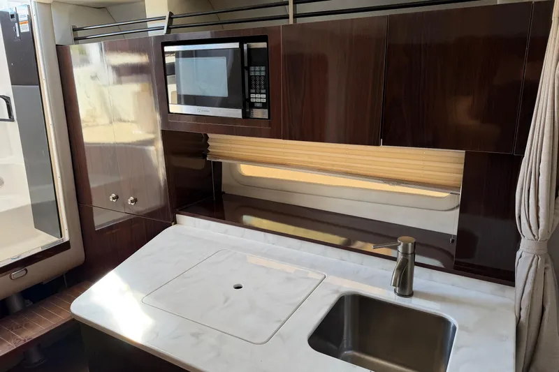  Yacht Photos Pics Luxurious 2017 Sea Ray Sundancer 310 yacht kitchen with modern amenities and sleek design.