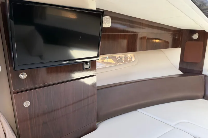  Yacht Photos Pics Interior of 2017 Sea Ray Sundancer 310 with TV and wood paneling.