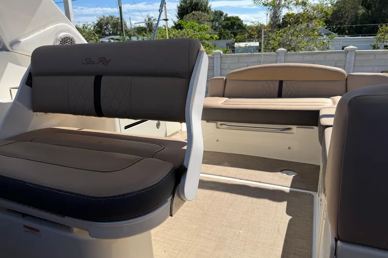  Yacht Photos Pics 2017 Sea Ray Sundancer 310 interior with beige seating and outdoor view.