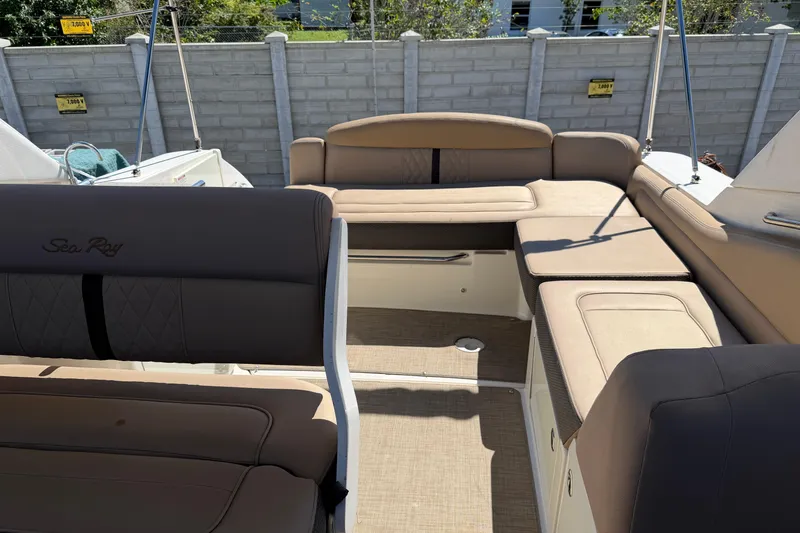  Yacht Photos Pics 2017 Sea Ray Sundancer 310 boat interior with beige seating and spacious layout.