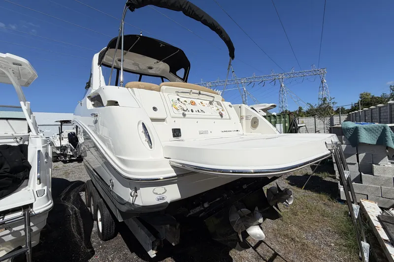  Yacht Photos Pics 2017 Sea Ray Sundancer 310 boat on trailer, outdoor storage, clear sky background.