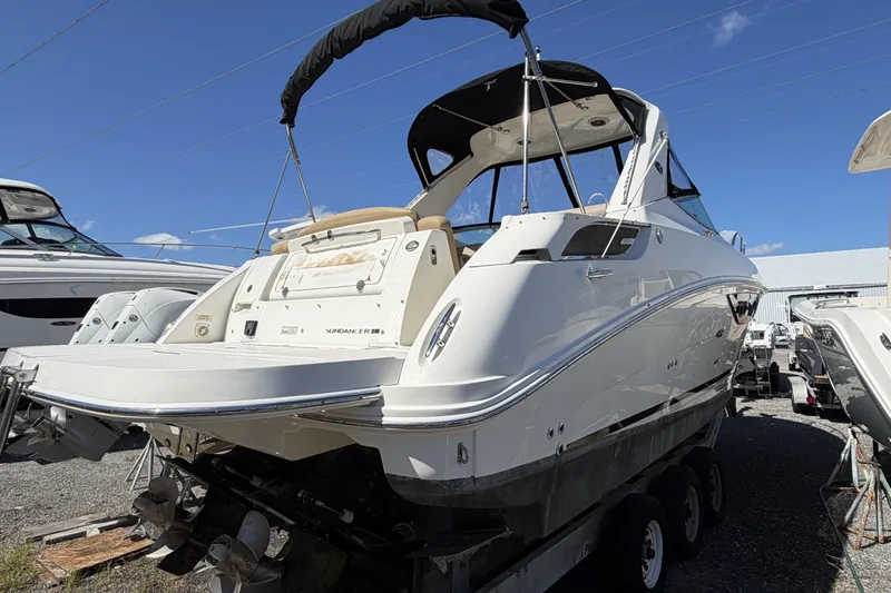  Yacht Photos Pics 2017 Sea Ray Sundancer 310 boat on trailer under clear blue sky.