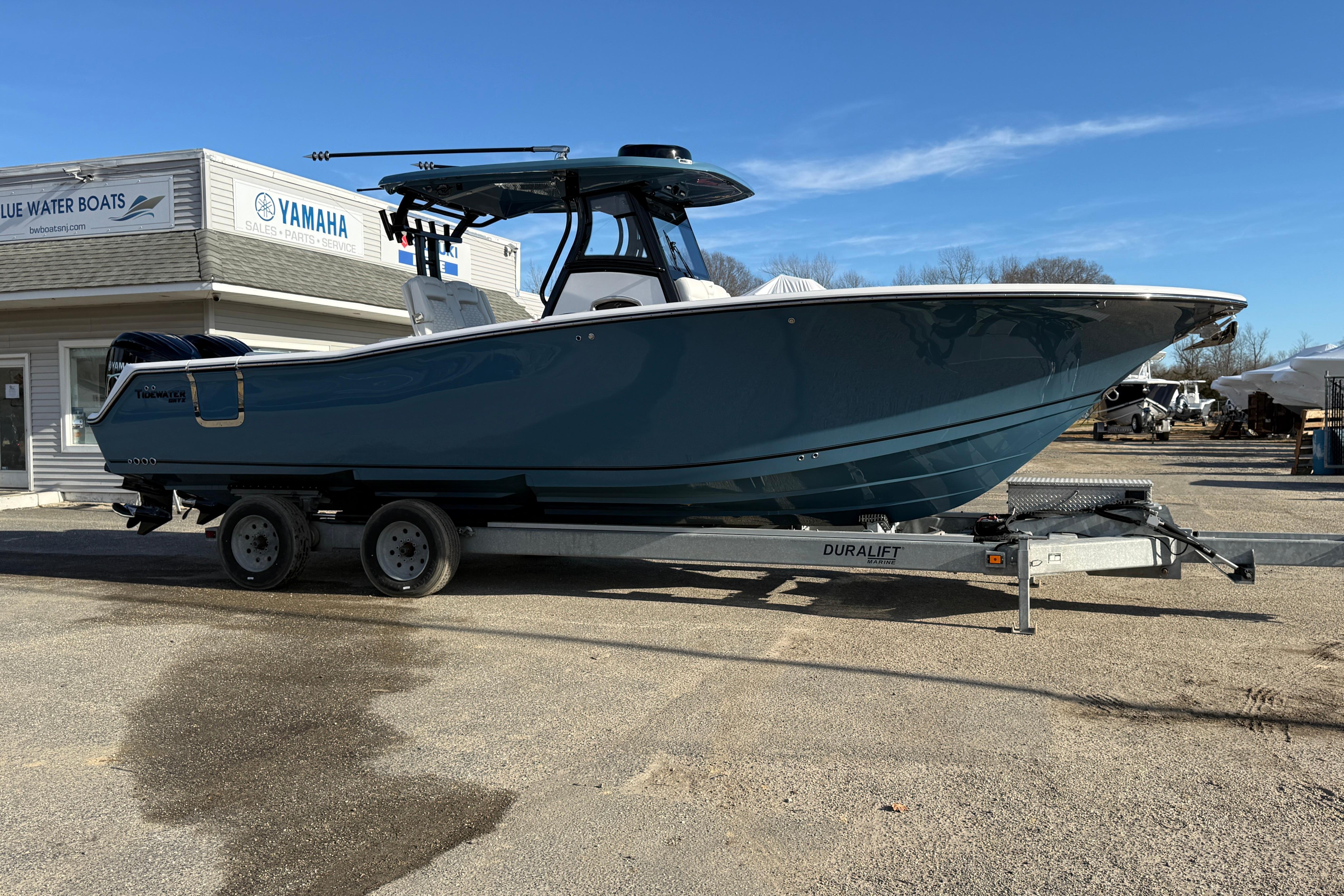 2026 Tidewater 302 CC Adventure boat on trailer at dealership.