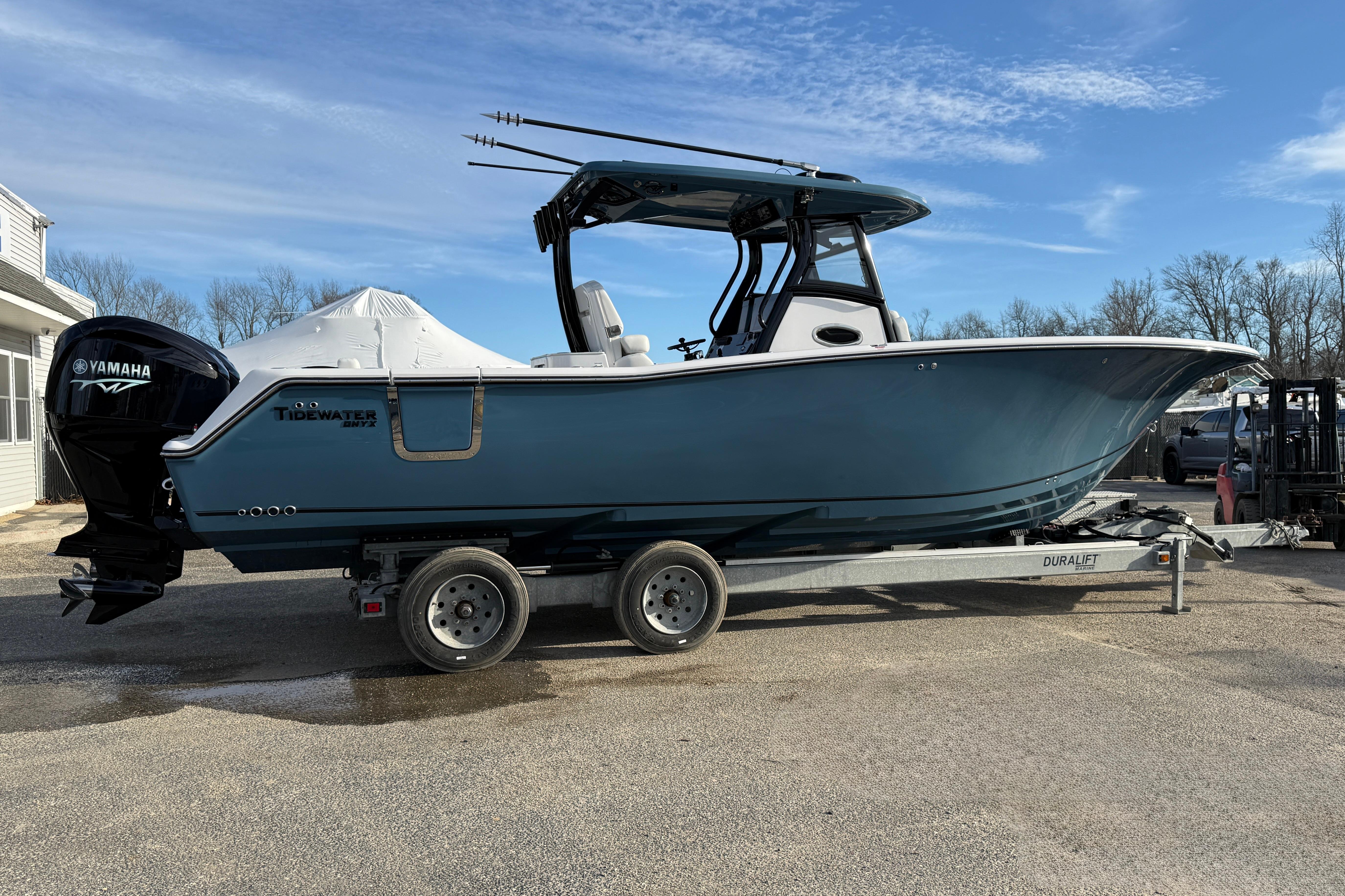 2026 Tidewater 302 CC Adventure boat on trailer, featuring Yamaha engine, parked outdoors.