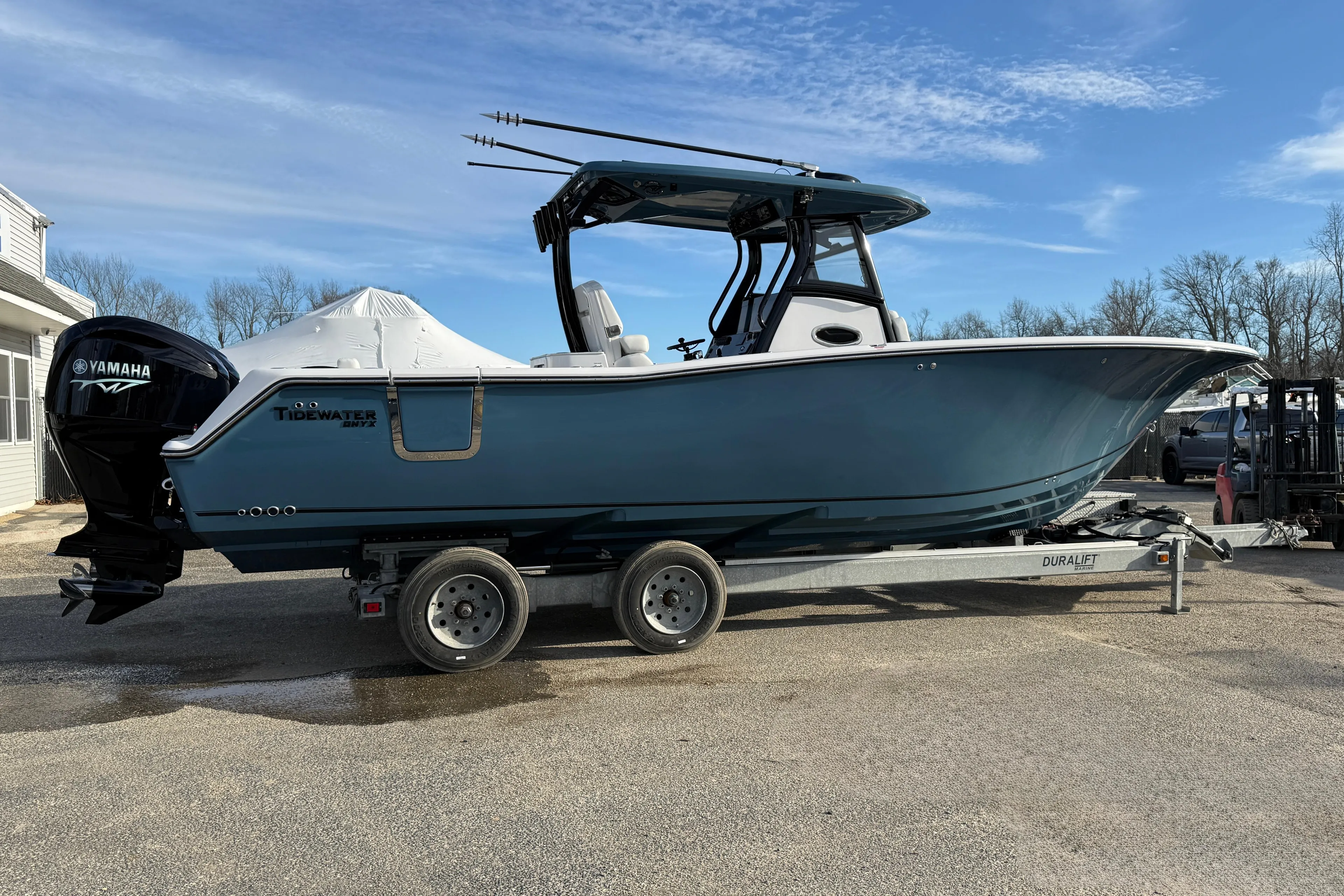 2026 Tidewater 302 CC Adventure boat on trailer, featuring Yamaha engine, parked outdoors.