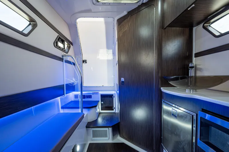  Yacht Photos Pics 2020 Edgewater 370CC cabin interior with modern design, blue lighting, and compact amenities.