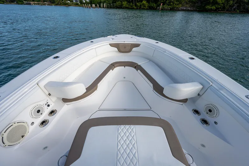  Yacht Photos Pics Bow seating area of a 2020 Edgewater 370CC boat on calm water.