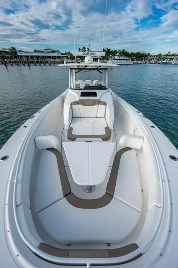  Yacht Photos Pics 2020 Edgewater 370CC boat on calm water, showcasing spacious deck and seating.
