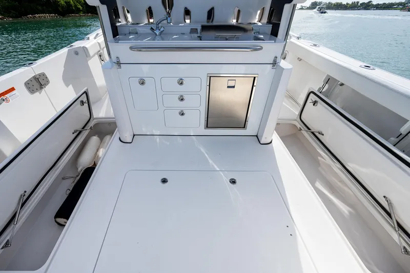  Yacht Photos Pics 2020 Edgewater 370CC boat interior with storage compartments and stainless steel fixtures.