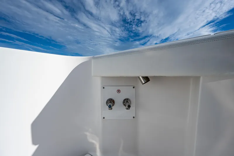  Yacht Photos Pics Edgewater 370CC 2020 boat detail against a vibrant blue sky.