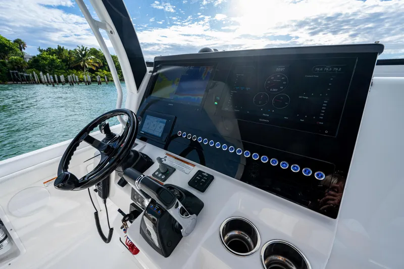  Yacht Photos Pics Helm of 2020 Edgewater 370CC boat with modern controls and digital display.
