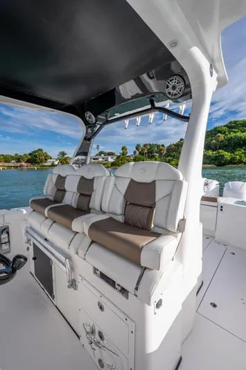  Yacht Photos Pics 2020 Edgewater 370CC boat interior with cushioned seating and scenic water view.
