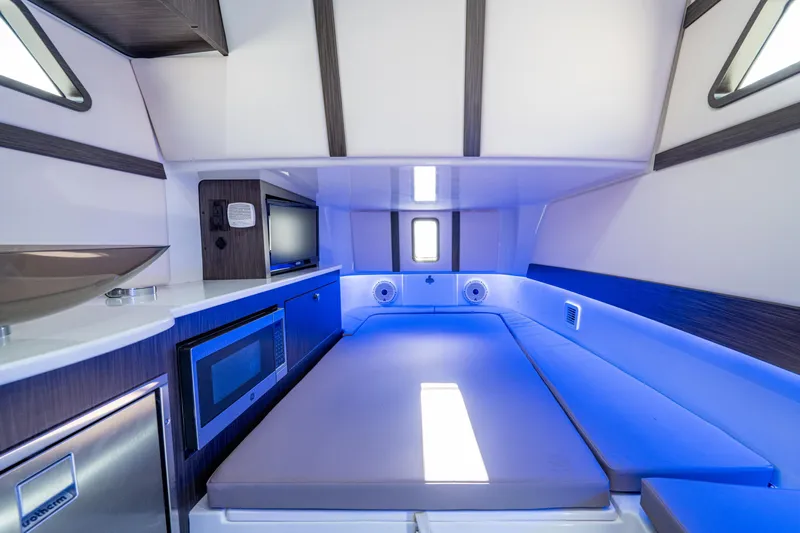  Yacht Photos Pics Interior of 2020 Edgewater 370CC boat with modern amenities and blue ambient lighting.