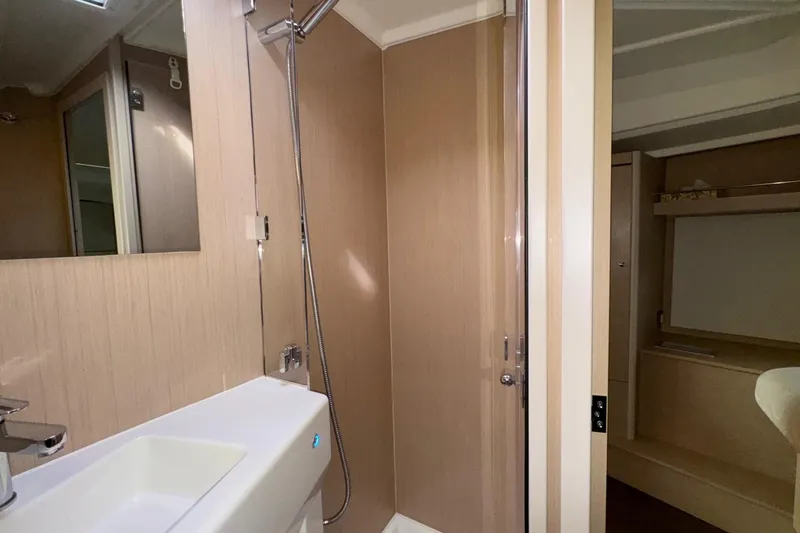 Bluebird Yacht Photos Pics Interior of 2022 Beneteau Oceanis 40.1 yacht bathroom with modern fixtures and wood paneling.