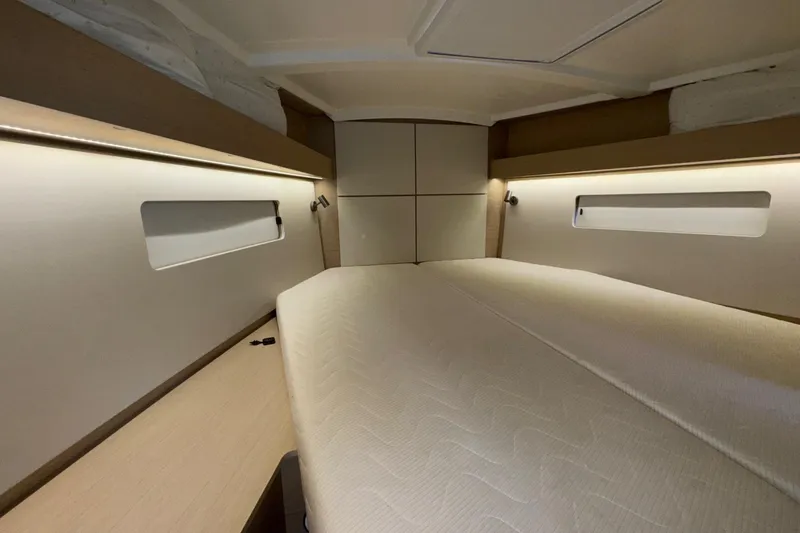 Bluebird Yacht Photos Pics Interior cabin of 2022 Beneteau Oceanis 40.1 yacht, featuring modern design and cozy bedding.