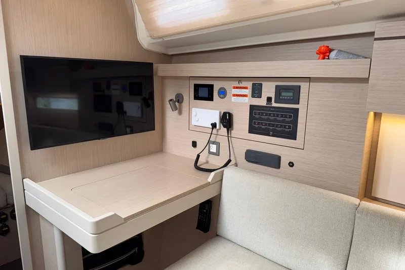 Bluebird Yacht Photos Pics Interior of 2022 Beneteau Oceanis 40.1 yacht with control panel and TV.