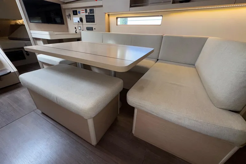 Bluebird Yacht Photos Pics Interior of 2022 Beneteau Oceanis 40.1 yacht with modern dining area and seating.