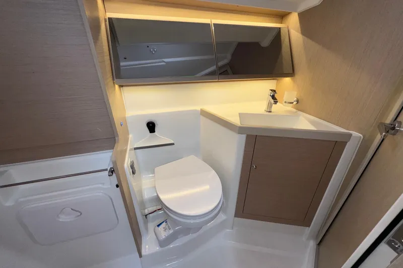 Bluebird Yacht Photos Pics Modern bathroom in 2022 Beneteau Oceanis 40.1 yacht, featuring sleek fixtures and ample storage.