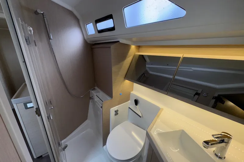 Bluebird Yacht Photos Pics Modern bathroom interior of 2022 Beneteau Oceanis 40.1 yacht, featuring sleek fixtures and ample lighting.