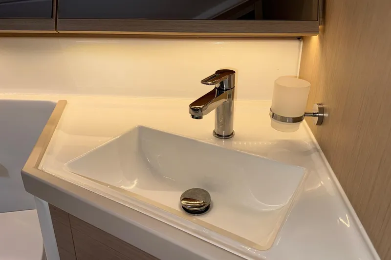 Bluebird Yacht Photos Pics Modern bathroom sink with chrome faucet in 2022 Beneteau Oceanis 40.1 yacht.
