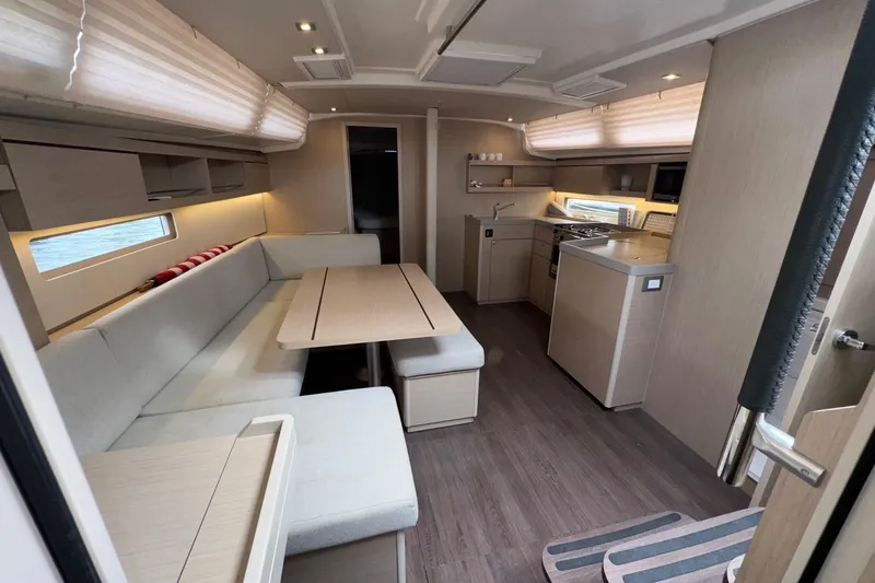 Bluebird Yacht Photos Pics Modern interior of 2022 Beneteau Oceanis 40.1 yacht with spacious seating and kitchen area.