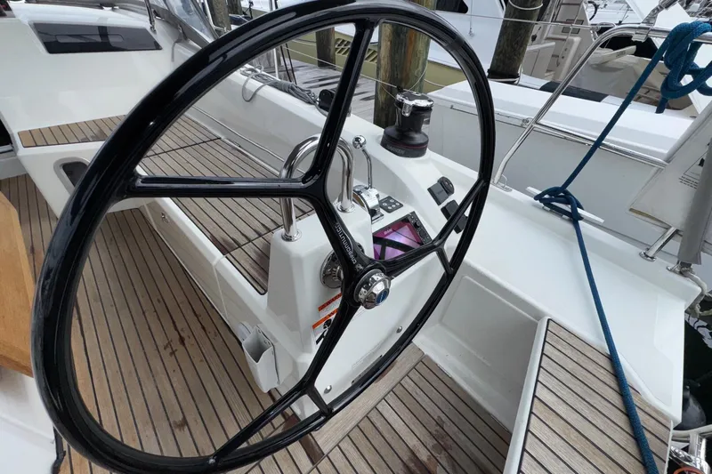 Bluebird Yacht Photos Pics Steering wheel of 2022 Beneteau Oceanis 40.1 yacht with teak deck details.
