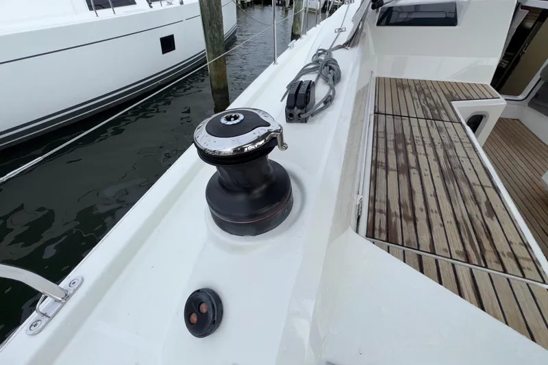 Bluebird Yacht Photos Pics Deck view of 2022 Beneteau Oceanis 40.1 sailboat, featuring winch and teak flooring.